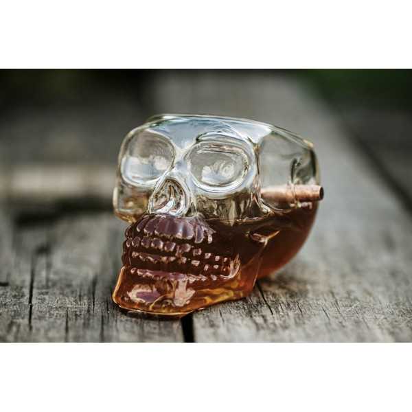 Skull-shaped goblet with bullet