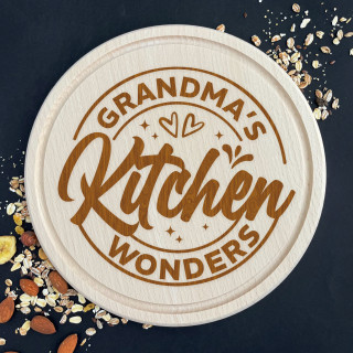 Engraved round cutting board "Grandma’s kitchen wonders"